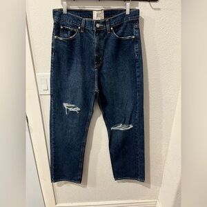 BDG High-Waisted Cowboy Jeans in a dark wash with distressed